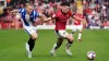 Anthony Scully, left, sealed the three points for Colchester at Newport (David Davies/PA)