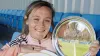 Erin Cuthbert holds up her award from the Scottish Football Writers’ Association (Steve Welsh/PA)