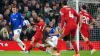 Everton’s James Tarkowski challenges Liverpool’s Alexis Mac Allister (Peter Byrne/PA)