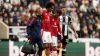 Manchester United’s Joshua Zirkzee, second left, is helped from the pitch after picking up an injury (Owen Humphreys/PA)