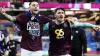 Burnley’s Josh Brownhill, left, and Connor Roberts celebrate securing promotion to the Premier League (Nick Potts/PA)