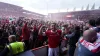 Wrexham’s Sam Smith leads the celebrations after their win (PA)
